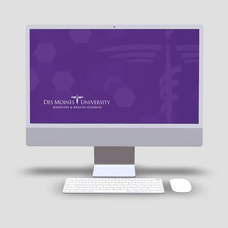 Mockup of a DMU desktop wallpaper being used on a computer. Device mockup created from deviceframes.com.