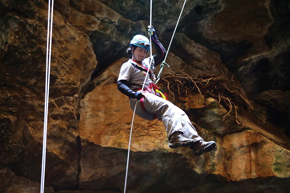 Julie Meachen, Ph.D., rappels 80 feet into the Natural Trap Cave in northern Wyoming. The chamber itself only measures 140 feet in diameter.