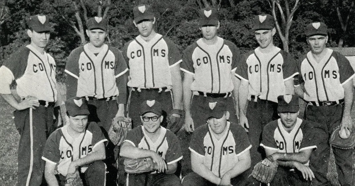 A vintage COMS baseball team photo showing players standing and kneeling in uniform.