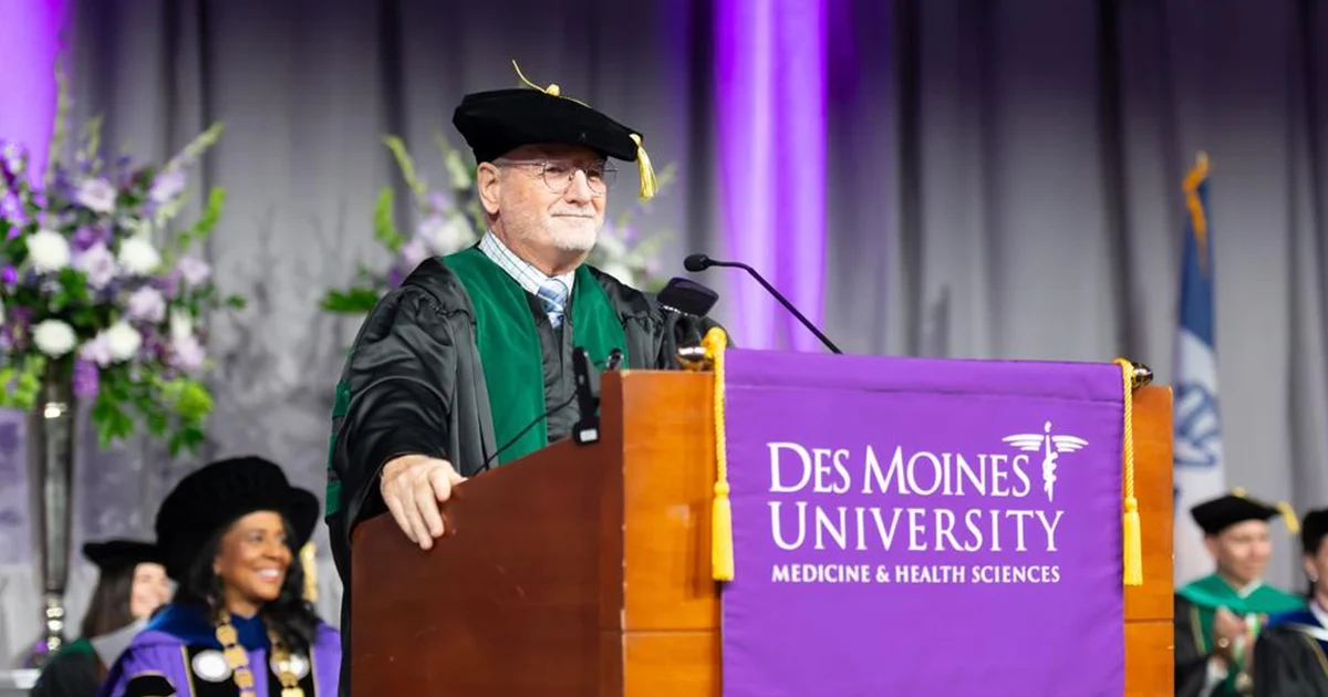 Commencement speaker, George Rust MD, MPH, FAAFP, FACPM, at the podium.