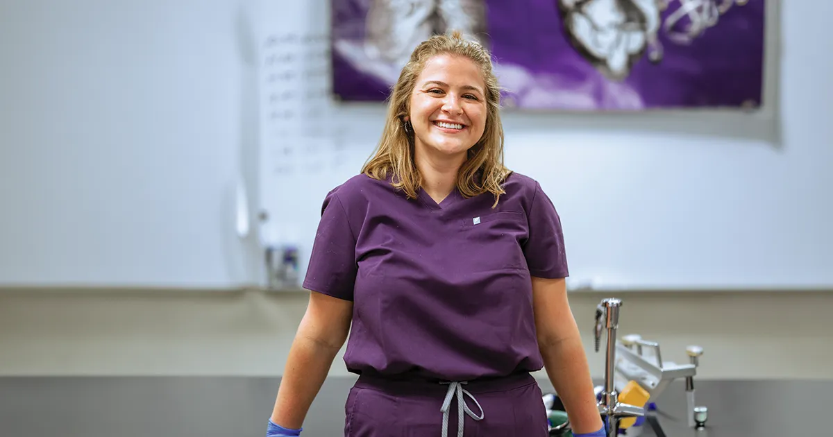 Elizabeth (Lizo) McMahon, DO’28, stands in a classroom during an Anatomy Ambassadors Program event at Ankeny Centennial High School.