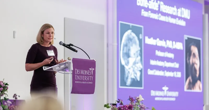 Heather Garvin, PhD, gives a research presentation at the 2026 Grand Celebration event.