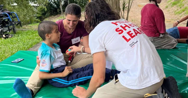 Melissa Demczak in Costa Rica assisting a young patient.