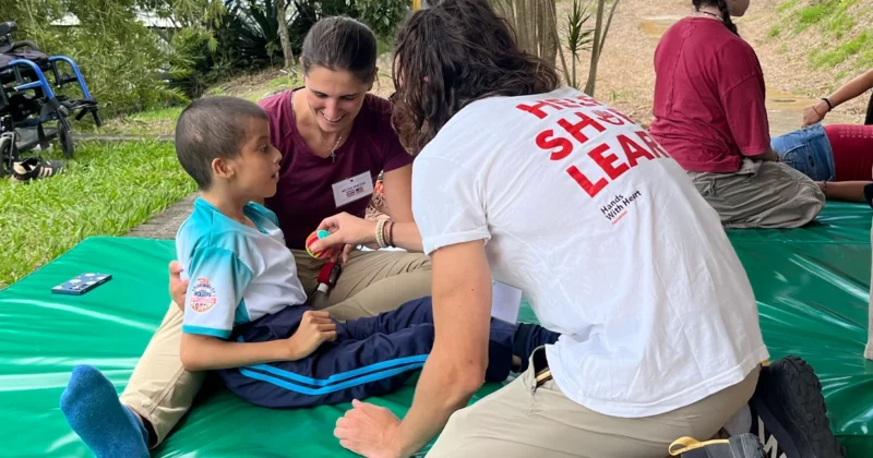 Melissa Demczak in Costa Rica assisting a young patient.