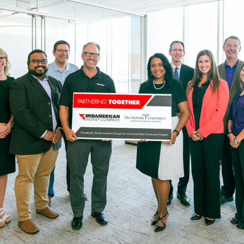 From left, MidAmerican Energy representatives Katie Lord, business and community development manager; Vinoth Sekar, project manager; Dave Johnson, director, business connections; and Steve Willem, lead business connection manager, present a rebate check to DMU representatives President and CEO Angela L. Walker Franklin, Ph.D.; Mark Peiffer, M.B.A., CPA, senior vice president and chief financial officer; Stephanie Greiner, M.S., vice president, university advancement; John Harris, director, facilities management; and Vickie Harper-Halverson, business operations analyst.