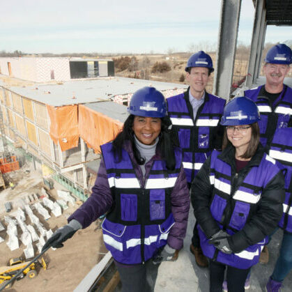 DMU’s New Campus Steering Committee poses for a photo during construction of the new campus in West Des Moines.